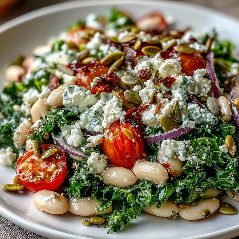 Colorful white bean and kale salad, perfectly massaged and ready to be enjoyed.
