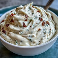 Creamy homemade garlic aioli, perfect for dipping fries or spreading on sandwiches, with a rich, garlicky aroma.